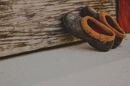 Shoes in mudroom, organized by professional organizer