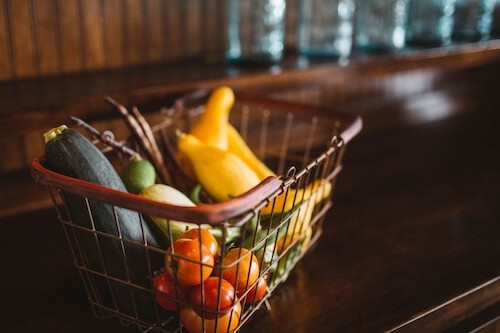 fruit in a basket in an organized kitchen