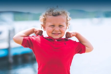 Boy flexing muscles