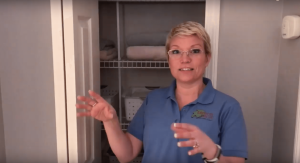 Professional organizer showing how to light a dark linen closet or pantry