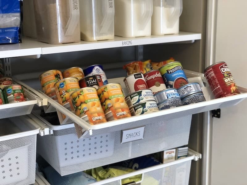 Pull out pantry shelf in organized and decluttered pantry