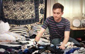 Man decluttering items in his home