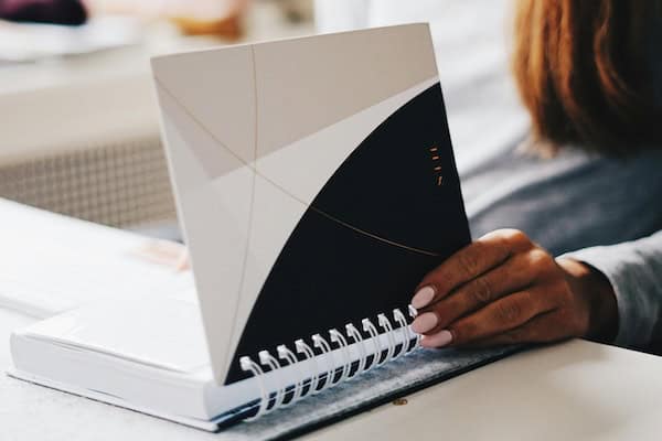 Hand holding an organizing planner