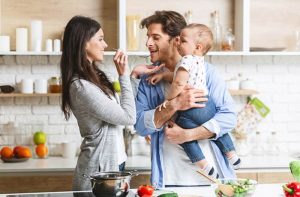 parents with child in kitchen organized by professionals