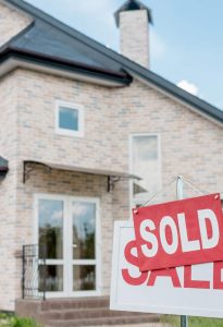 Home with Sold Sign after being decluttered and organized