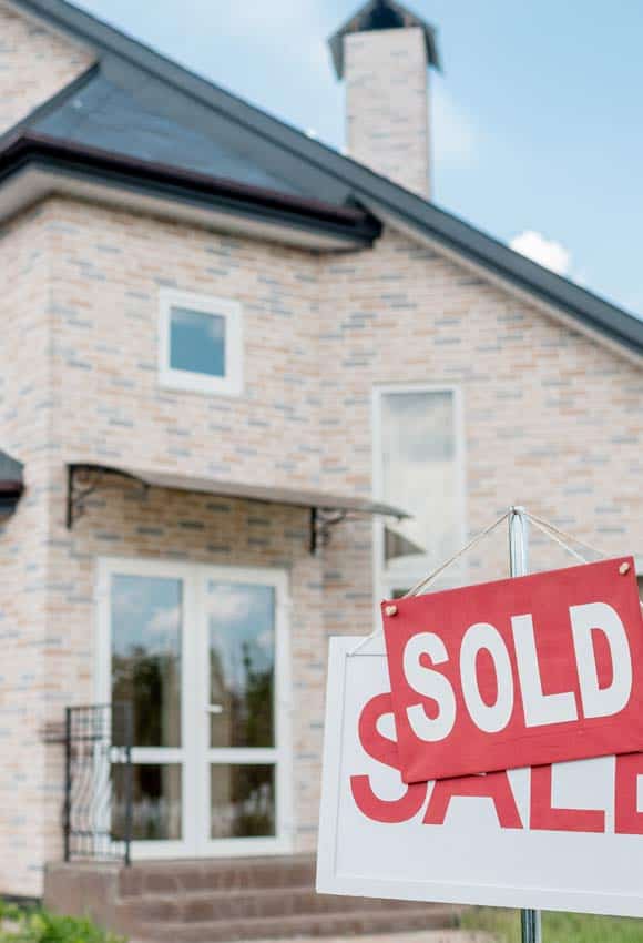 Home with Sold Sign after being decluttered and organized