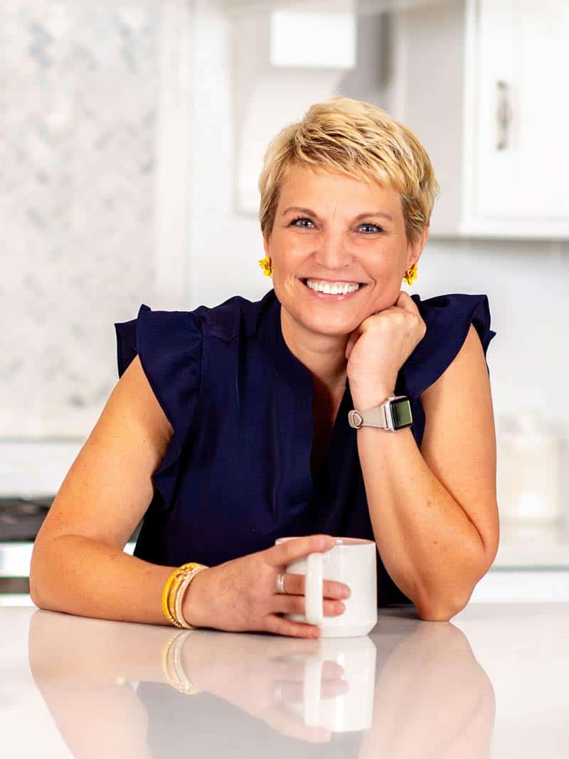 Professional organizer Susan Stewart sitting with cup of coffee