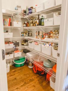 Usable, decluttered kitchen pantry. Work completed by home organizers