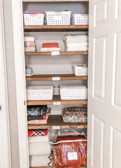 View of organized linen closet. Work completed by best professional organizer Susan Stewart