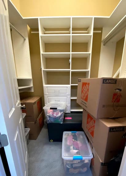 Closet before being unpacked and organized by professional unpacking services at Perfectly Placed Organization & Design, LLC in St. Louis