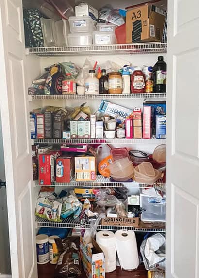 Kitchen pantry before being organized professionally by home organizing company in St. Louis