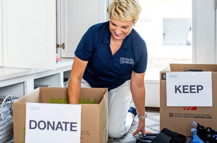 Experienced professional organizer Susan Stewart of Perfectly Placed sorting through boxes