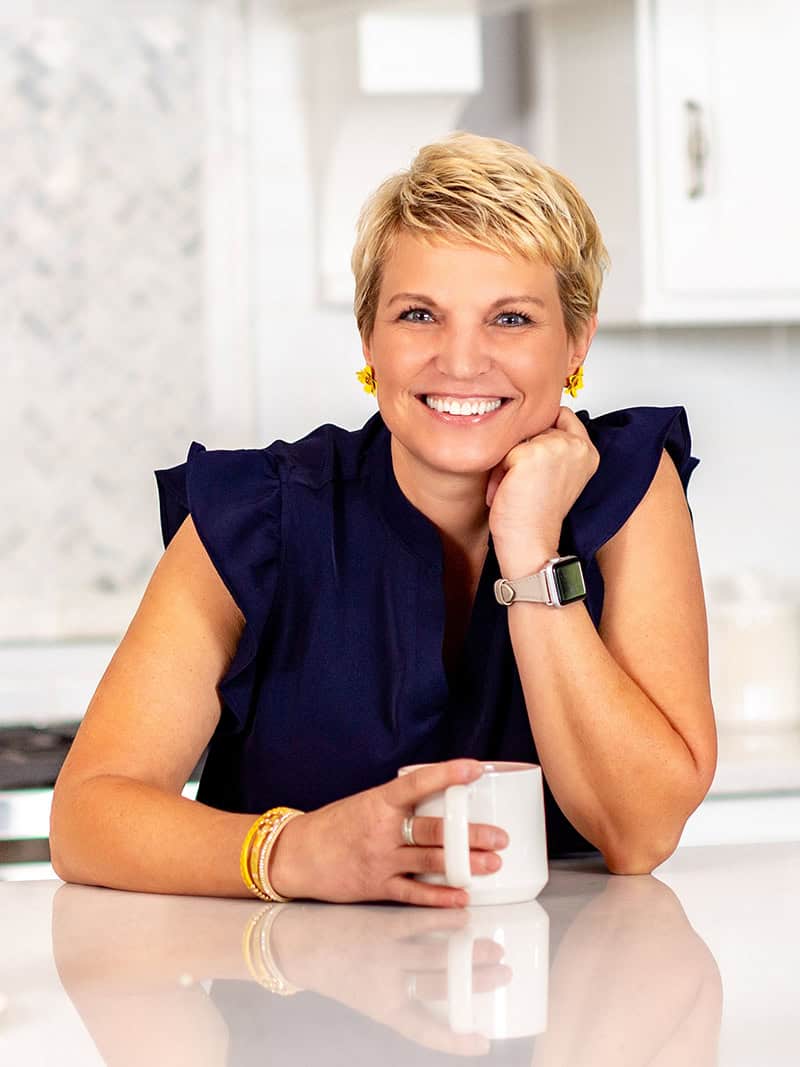 Top rated Professional Organizer in St. Louis, Susan Stewart smiling with cup of coffee