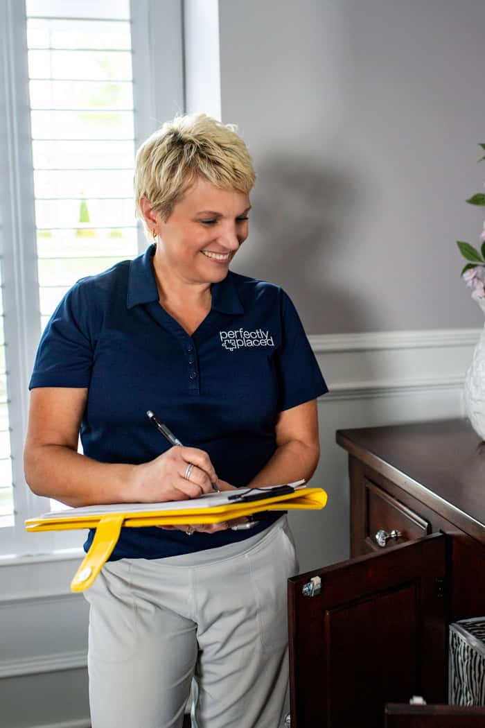 Professional Organizer St. Louis, Susan Stewart, working in a home